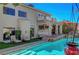 Charming backyard featuring a pool, outdoor seating, and access to an outdoor kitchen at 7420 Enchanted Hills Ct, Las Vegas, NV 89129