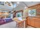 Entertaining bar with natural light, wine rack, sink, and backyard views at 7420 Enchanted Hills Ct, Las Vegas, NV 89129