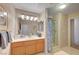 Bathroom featuring a shower, vanity, and natural light at 7420 Enchanted Hills Ct, Las Vegas, NV 89129