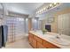 Bathroom featuring double sinks and a shower-tub combo at 7420 Enchanted Hills Ct, Las Vegas, NV 89129