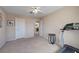 Bedroom with carpet flooring, neutral paint, ceiling fan, and access to other rooms at 7420 Enchanted Hills Ct, Las Vegas, NV 89129