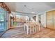 Dining area with wood-look flooring and a view of the outdoor area at 7420 Enchanted Hills Ct, Las Vegas, NV 89129