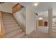 Inviting entryway featuring carpeted stairs and an open floor plan leading to the living spaces at 7420 Enchanted Hills Ct, Las Vegas, NV 89129