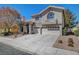 Charming two-story home with a three car garage and well-maintained landscaping at 7420 Enchanted Hills Ct, Las Vegas, NV 89129
