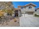 Charming stucco house featuring a well-manicured desert landscaped yard at 7420 Enchanted Hills Ct, Las Vegas, NV 89129