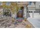 Home exterior featuring desert landscaping and decorative security gate at entrance at 7420 Enchanted Hills Ct, Las Vegas, NV 89129