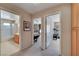 Hallway with carpet flooring, access to bathroom, bedroom, and exercise room at 7420 Enchanted Hills Ct, Las Vegas, NV 89129