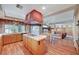 Well-appointed kitchen offering a gas cooktop island, wood cabinets, and modern fixtures at 7420 Enchanted Hills Ct, Las Vegas, NV 89129