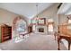Inviting living room with fireplace, large window, and classic decor at 7420 Enchanted Hills Ct, Las Vegas, NV 89129