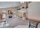 Spacious living room boasts fireplace, balcony, and view of the dining room at 7420 Enchanted Hills Ct, Las Vegas, NV 89129