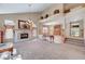 Bright living room showcasing a fireplace, high ceilings, and open floor plan at 7420 Enchanted Hills Ct, Las Vegas, NV 89129