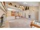 Expansive living area featuring a fireplace and an open layout to the dining area at 7420 Enchanted Hills Ct, Las Vegas, NV 89129