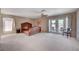 Large main bedroom with ceiling fan and balcony access, offering plenty of natural light at 7420 Enchanted Hills Ct, Las Vegas, NV 89129