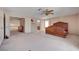 Spacious main bedroom with ceiling fan, neutral walls, and doorway to ensuite bath and closet at 7420 Enchanted Hills Ct, Las Vegas, NV 89129
