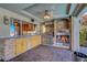 Outdoor kitchen with stone countertops at 7420 Enchanted Hills Ct, Las Vegas, NV 89129