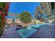 Inviting backyard spa with water feature and lush greenery at 7420 Enchanted Hills Ct, Las Vegas, NV 89129
