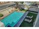 Aerial view of a private backyard featuring a sparkling in-ground swimming pool and patio furniture at 7420 Enchanted Hills Ct, Las Vegas, NV 89129