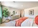 Bright bedroom with a decorative mirror and a potted tree at 7449 Bosco Dr # Lot 106, North Las Vegas, NV 89084