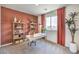 Bright office featuring warm colored walls, decorative shelving, desk, and stylish plants at 7449 Bosco Dr # Lot 106, North Las Vegas, NV 89084