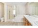 Bright bathroom featuring a shower over tub and double sink vanity with modern finishes at 7486 River Dove Ct, Las Vegas, NV 89139