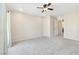 Large bedroom featuring carpet flooring, neutral walls, and a doorway at 7486 River Dove Ct, Las Vegas, NV 89139