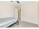 View of a bedroom with a ceiling fan, neutral carpet, and an open doorway at 7486 River Dove Ct, Las Vegas, NV 89139