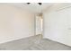 Carpeted bedroom with a ceiling fan and a closet with sliding doors at 7486 River Dove Ct, Las Vegas, NV 89139