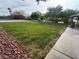 Community park featuring lush greenery, mature trees, walking paths, and convenient seating areas at 7486 River Dove Ct, Las Vegas, NV 89139