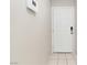 Entryway featuring clean lines, neutral paint, white door and tile flooring, creating a welcoming atmosphere at 7486 River Dove Ct, Las Vegas, NV 89139
