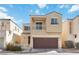Charming two-story home featuring a balcony, two-car garage and manicured landscaping at 7486 River Dove Ct, Las Vegas, NV 89139
