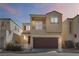 Charming two-story home featuring a balcony, two-car garage and manicured landscaping at 7486 River Dove Ct, Las Vegas, NV 89139
