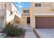 Charming two-story home featuring a balcony, two-car garage and manicured landscaping at 7486 River Dove Ct, Las Vegas, NV 89139