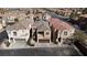Attractive two-story homes, with attached garages, and manicured desert landscaping at 7486 River Dove Ct, Las Vegas, NV 89139
