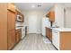 An efficient kitchen featuring ample wood cabinetry, stainless appliances, and durable countertops at 7486 River Dove Ct, Las Vegas, NV 89139
