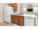 The open kitchen shows lots of cabinets, white countertops and stainless steel appliances at 7486 River Dove Ct, Las Vegas, NV 89139