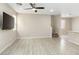 Spacious living room featuring a ceiling fan, and modern flooring at 7486 River Dove Ct, Las Vegas, NV 89139