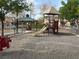 Community playground with slide and picnic shelter provides outdoor fun at 7486 River Dove Ct, Las Vegas, NV 89139