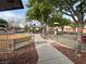 Playground with swings, slides, and picnic pavilion offers a Gathering-friendly community space at 7486 River Dove Ct, Las Vegas, NV 89139
