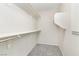 A walk-in closet with carpet flooring, ample shelving, and lighting fixtures at 7486 River Dove Ct, Las Vegas, NV 89139