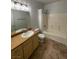 Bright bathroom featuring a tub and shower combination and large single sink vanity at 8250 N Grand Canyon Dr # 2085, Las Vegas, NV 89166