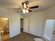 Bright bedroom with ceiling fan, ensuite bathroom, and door leading to the backyard at 8250 N Grand Canyon Dr # 2085, Las Vegas, NV 89166