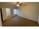 A spacious bedroom features a ceiling fan and a large window for natural lighting at 8250 N Grand Canyon Dr # 2085, Las Vegas, NV 89166