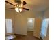A spacious bedroom featuring a ceiling fan, natural light, and an open closet at 8250 N Grand Canyon Dr # 2085, Las Vegas, NV 89166