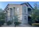 Neutral-toned apartment building featuring well-kept landscaping and clearly marked unit numbers at 8250 N Grand Canyon Dr # 2085, Las Vegas, NV 89166