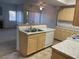 Open kitchen with stainless steel appliances, breakfast bar, and seamless access to living area at 8250 N Grand Canyon Dr # 2085, Las Vegas, NV 89166