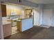 Kitchen featuring a modern stove, breakfast bar, and open layout for easy entertaining at 8250 N Grand Canyon Dr # 2085, Las Vegas, NV 89166