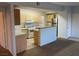 Bright kitchen view showcasing modern appliances, breakfast bar, and efficient layout at 8250 N Grand Canyon Dr # 2085, Las Vegas, NV 89166