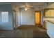 Open-concept living space with kitchen view, featuring bright lighting and functional design at 8250 N Grand Canyon Dr # 2085, Las Vegas, NV 89166