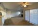 Living room with ceiling fan, fireplace, and sliding glass door for optimal light at 8250 N Grand Canyon Dr # 2085, Las Vegas, NV 89166