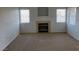 A well-lit living room featuring a modern fireplace and neutral decor at 8250 N Grand Canyon Dr # 2085, Las Vegas, NV 89166